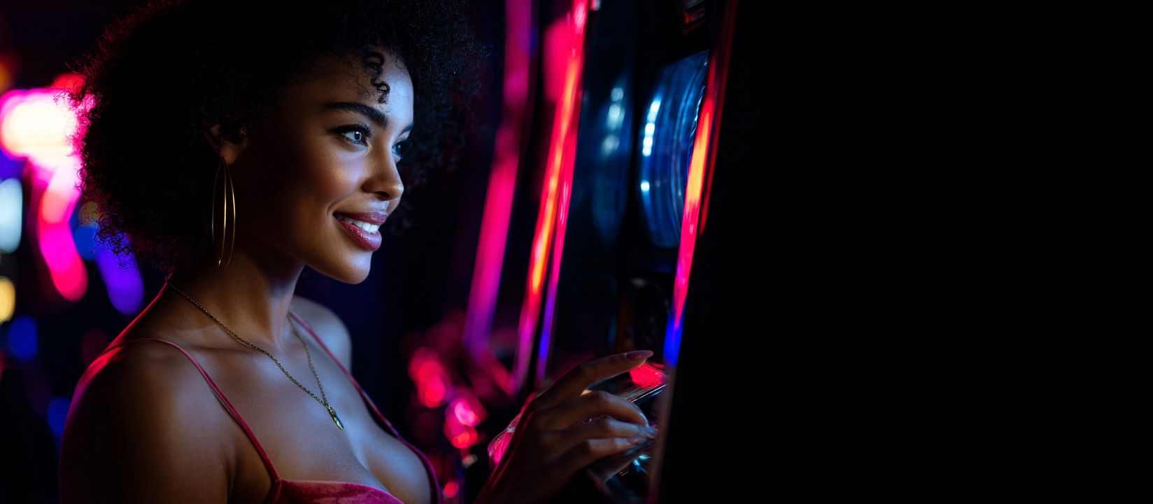 Spin the slots and hit the jackpot at 1423BET! Woman standing near bright slot machines at 1423BET Casino